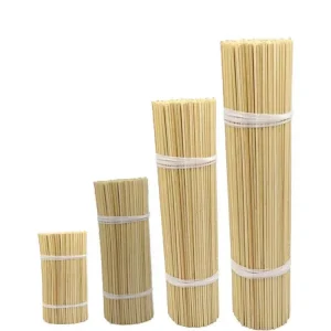 Four bundles of bamboo incense sticks in varying heights
