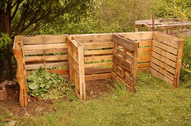 DIY wooden pallet bins set up for backyard composting