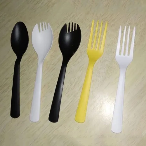 Mixed color plastic forks and sporks in a row Mixed color plastic forks and sporks in a row