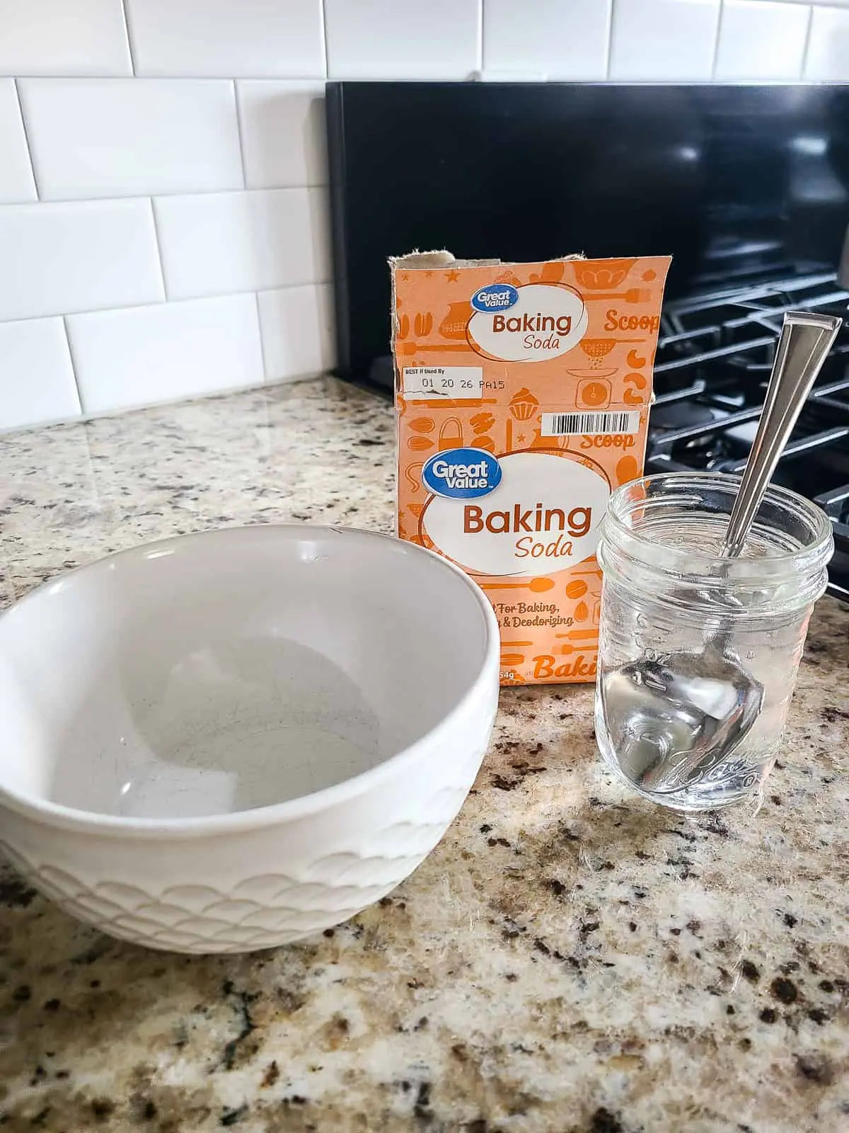 Baking soda paste with water in bowl on kitchen counter Baking soda paste with water in bowl on kitchen counter