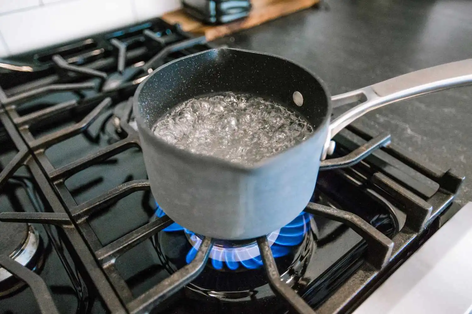 Pot of water boiling on a gas stove Pot of water boiling on a gas stove