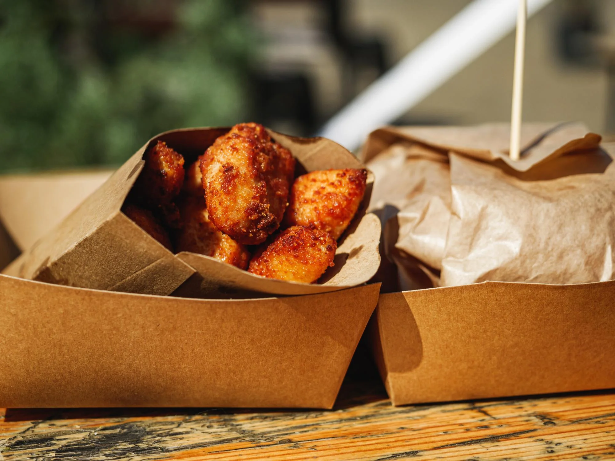 Crispy chicken in brown paper food tray Crispy chicken in brown paper food tray