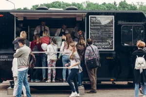Food truck serving meals with bagasse containers