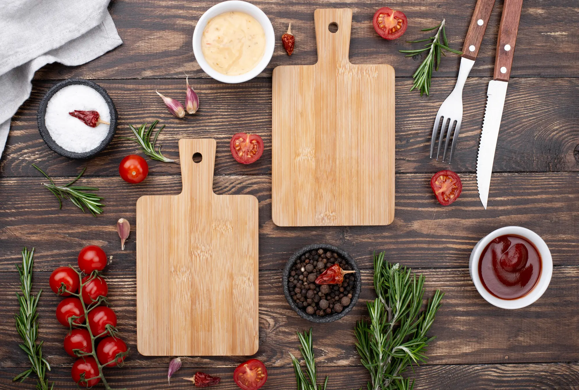 Birch cutting boards arranged with herbs and spices