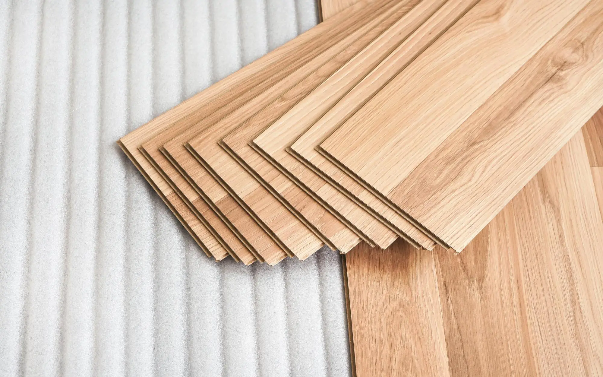 Birchwood planks stacked for flooring installation