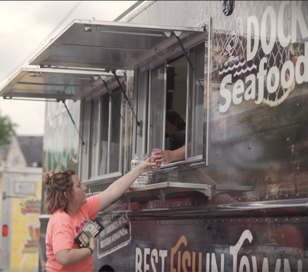 Customer ordering at a sustainable seafood food truck Customer ordering at a sustainable seafood food truck