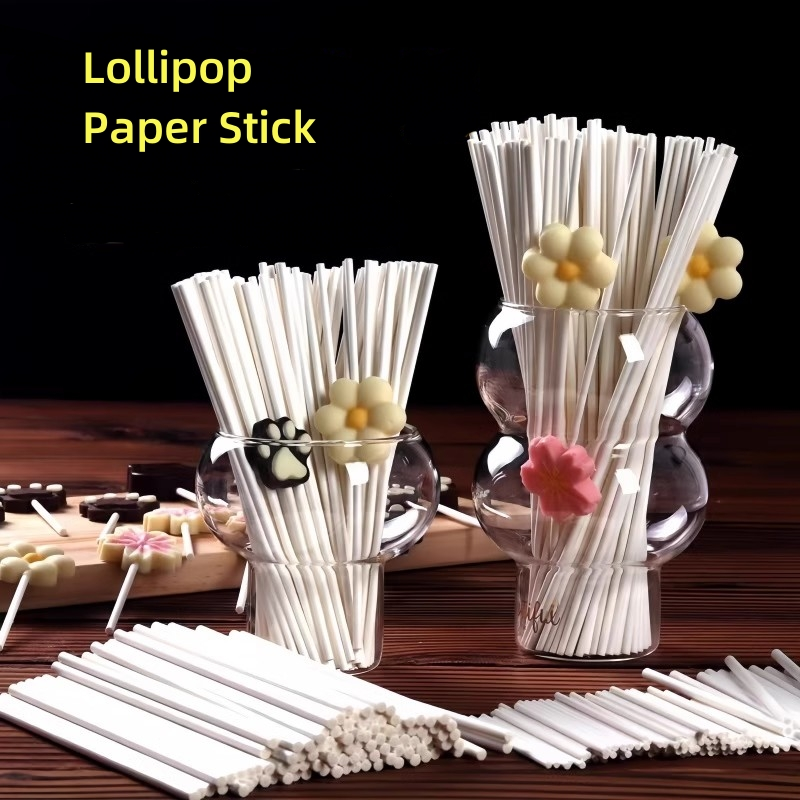 Lollipop paper sticks displayed in glass jars on table Lollipop paper sticks displayed in glass jars on table